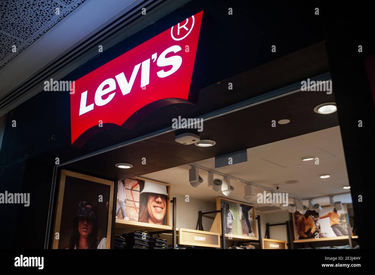 12.03.2020, Singapore, Republic of Singapore, Asia - Illuminated company sign and logo with the lettering of Levis (Levi Strauss & Co). Stock Photo