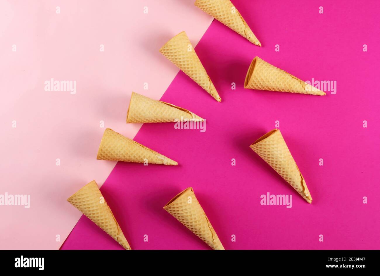 Emty Ice cream cones pattern on colored background. Top view. Several wafer ice cream cones designe Stock Photo