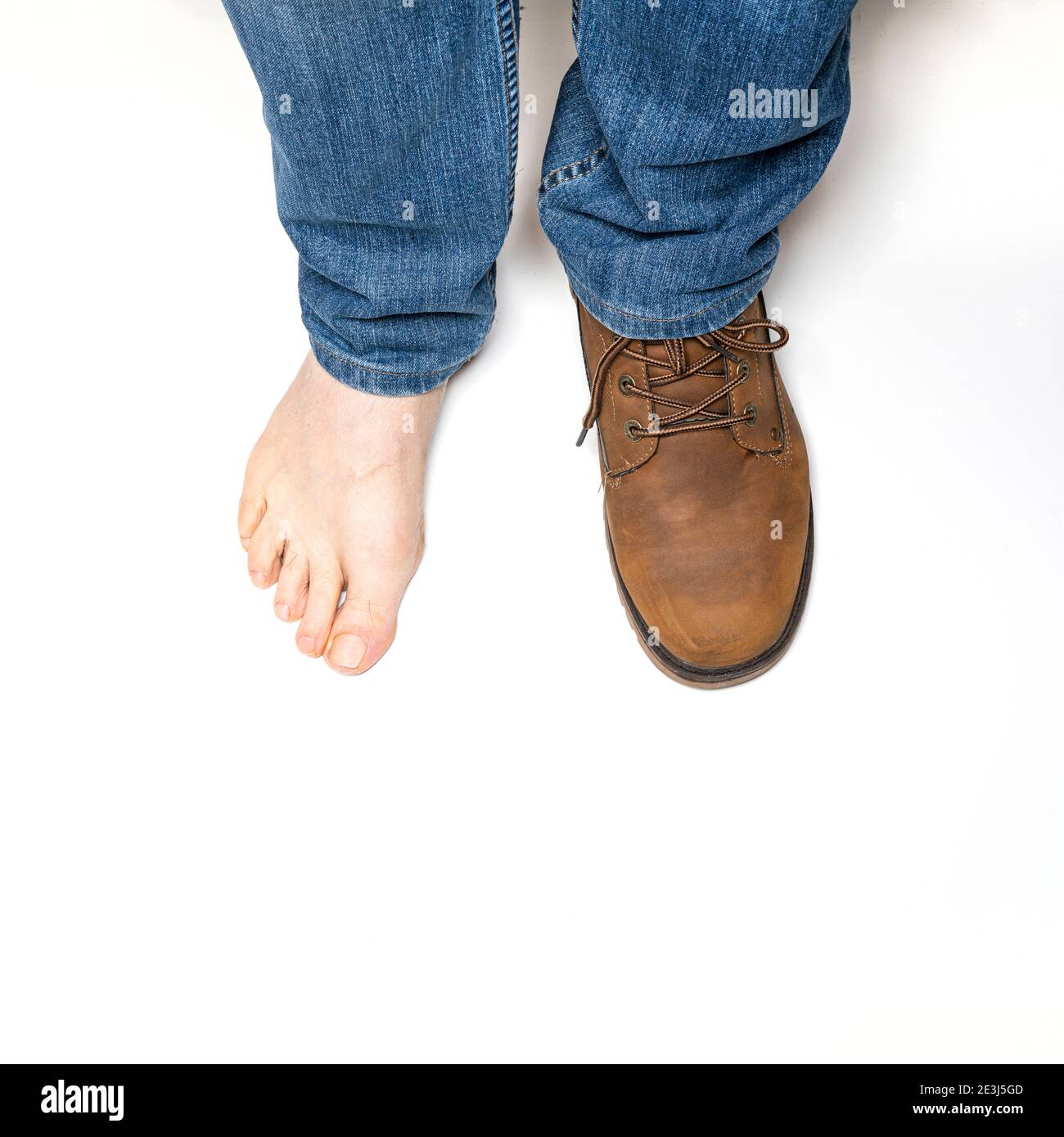 one foot with shoe and one barefoot Stock Photo