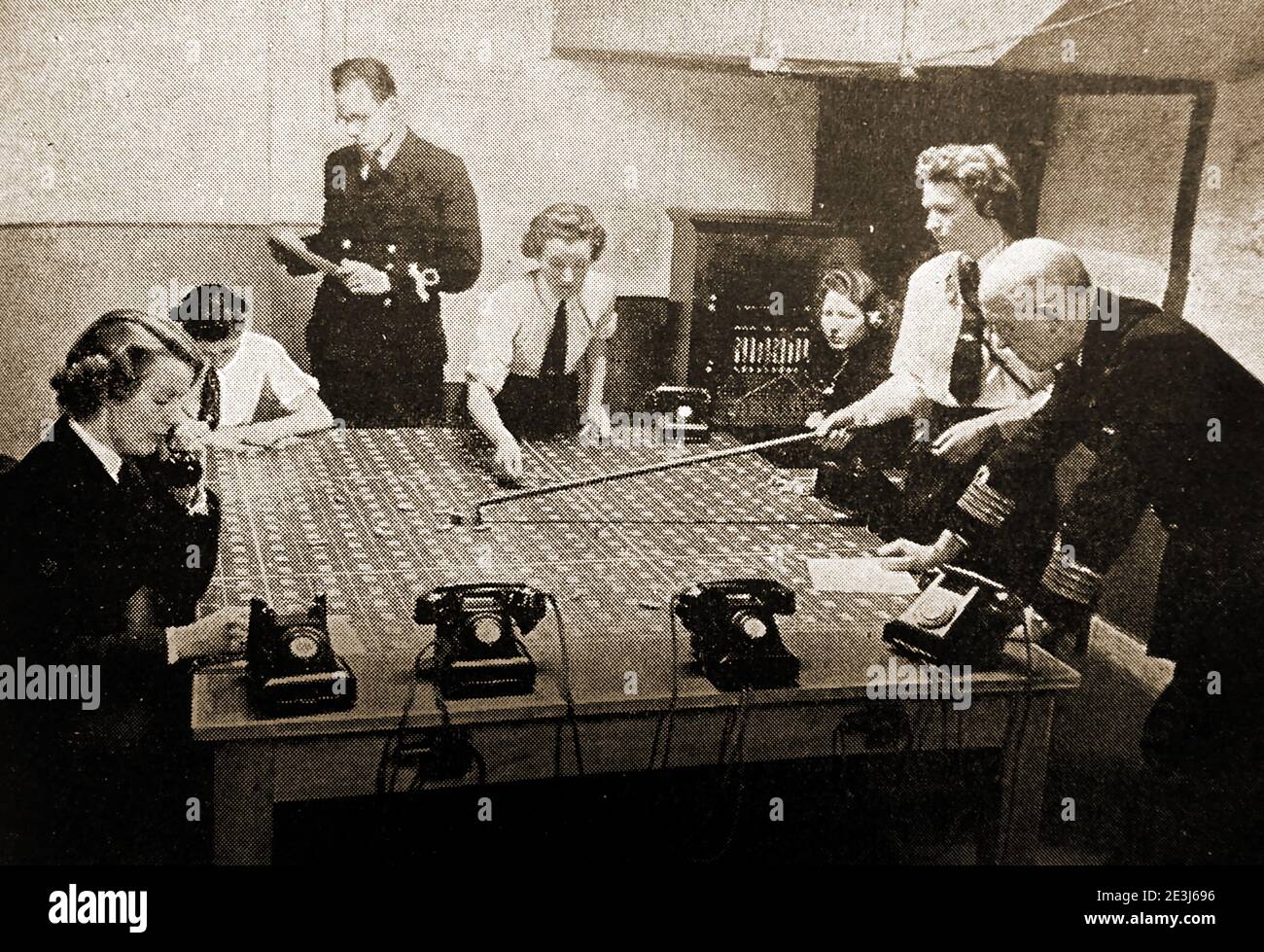 WWII - A printed photograph of British Wrens ( Women's Royal Naval Service), at work in a Naval operations room as plotters tracking the positions of various warships.First formed in 1917 for WWI, thendisbanded in 1919, only to be  revived in 1939 at the beginning of the Second World War. Integrated into the Royal Navy in 1993.  In 1939, Vera Laughton Mathews was appointed as the director of the re-formed WRNS with Ethel (Angela) Goodenough as her deputy Stock Photo