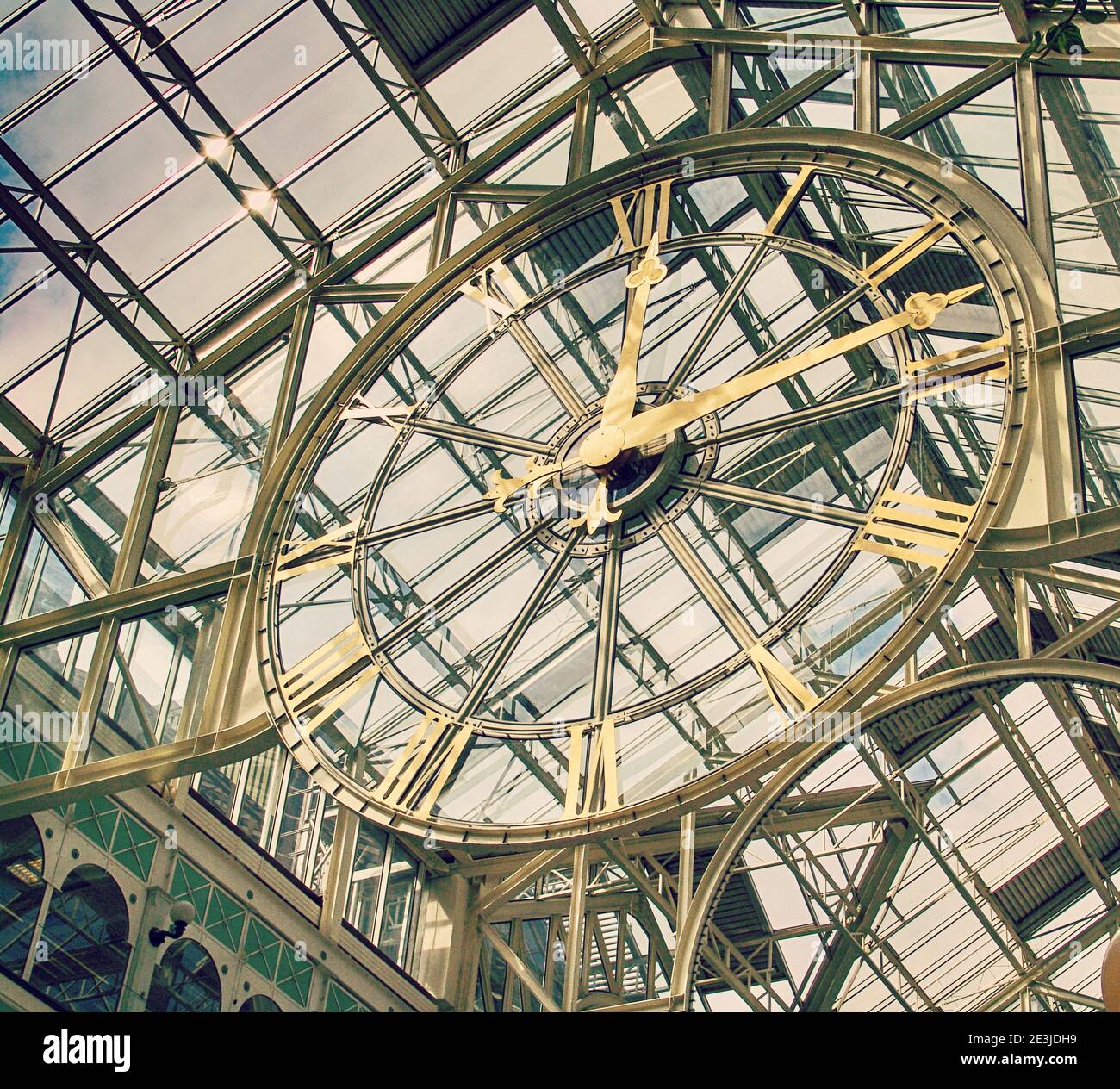 clock mounted on the glass ceiling of a market mall, the best