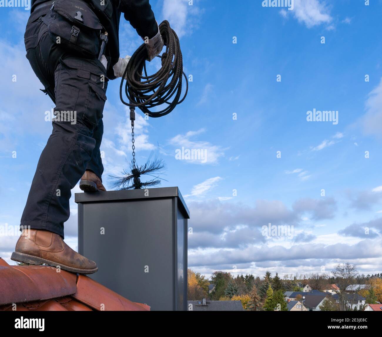 close up of a chimney sweep on the roof Stock Photo