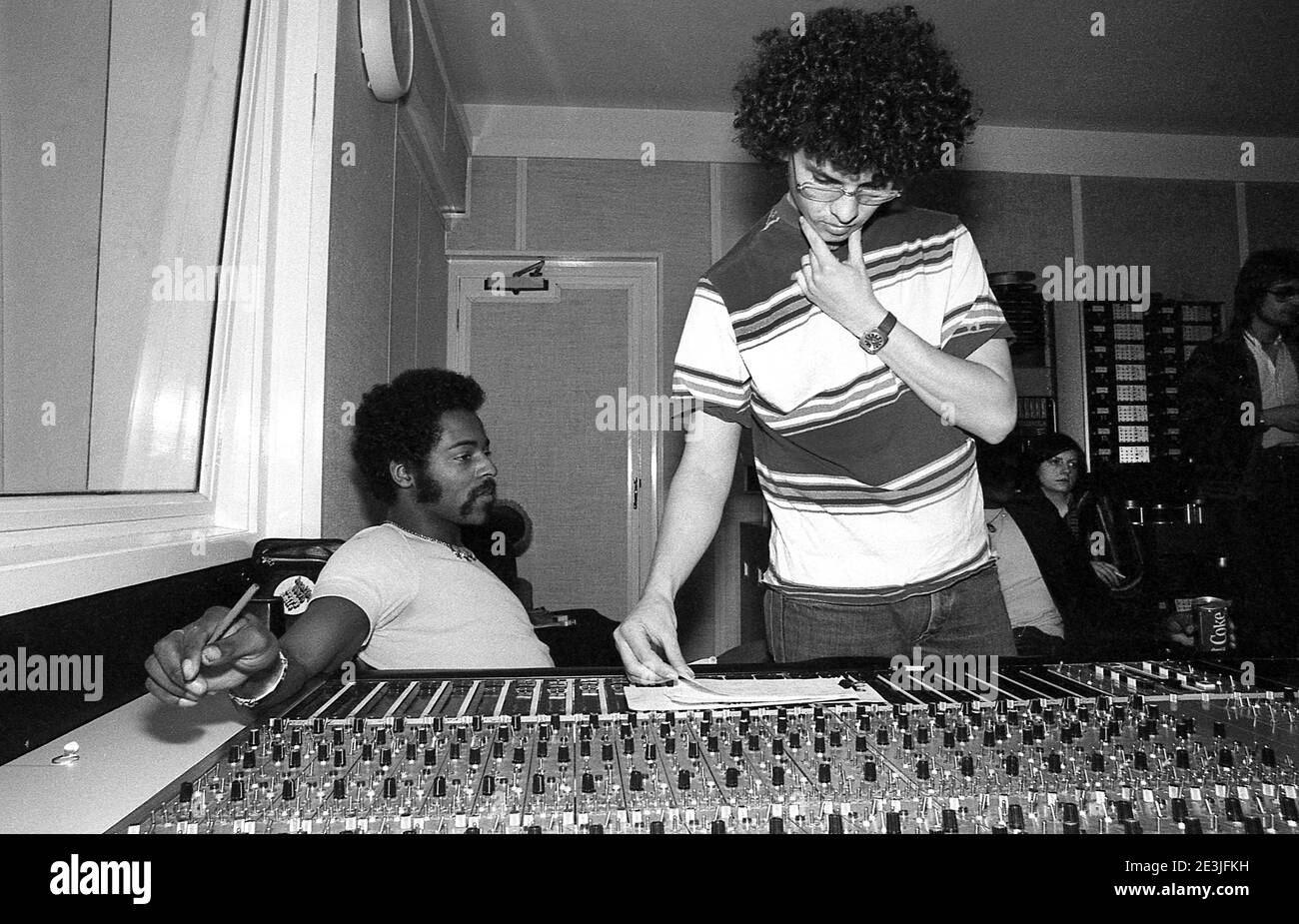 Eddie Amoo and recording engineer Denis Weinreich working on the Real Thing album '4 out of 8' at Scorpion Studios London UK 1977 Stock Photo