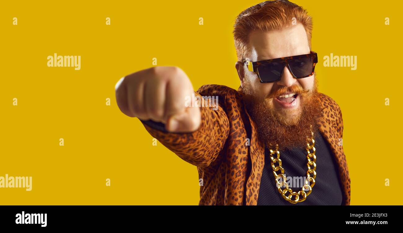 Banner with funny shouting young man in funky leopard print jacket and gold chain Stock Photo