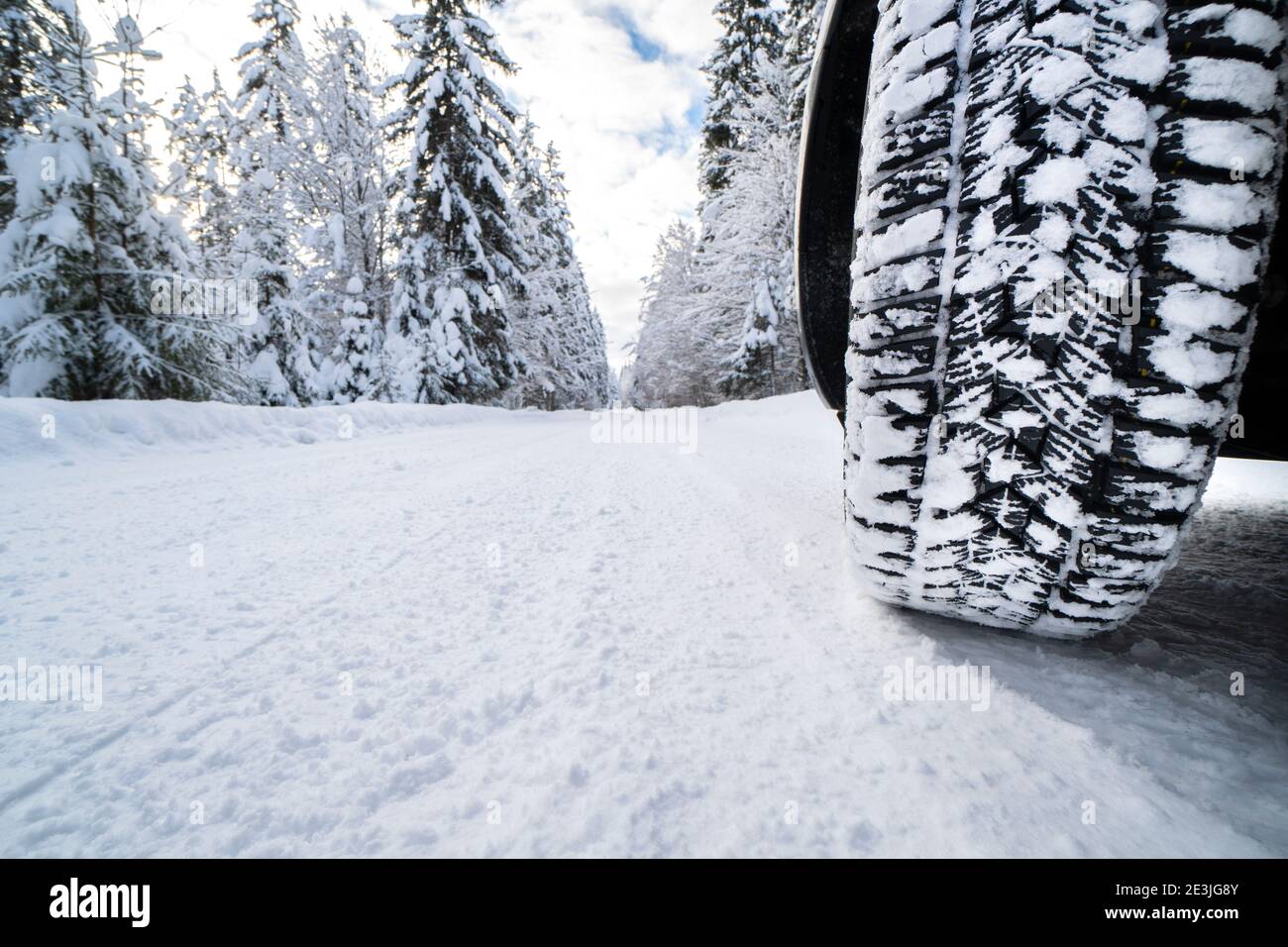 road sign warns of ice and snow at winter Stock Photo