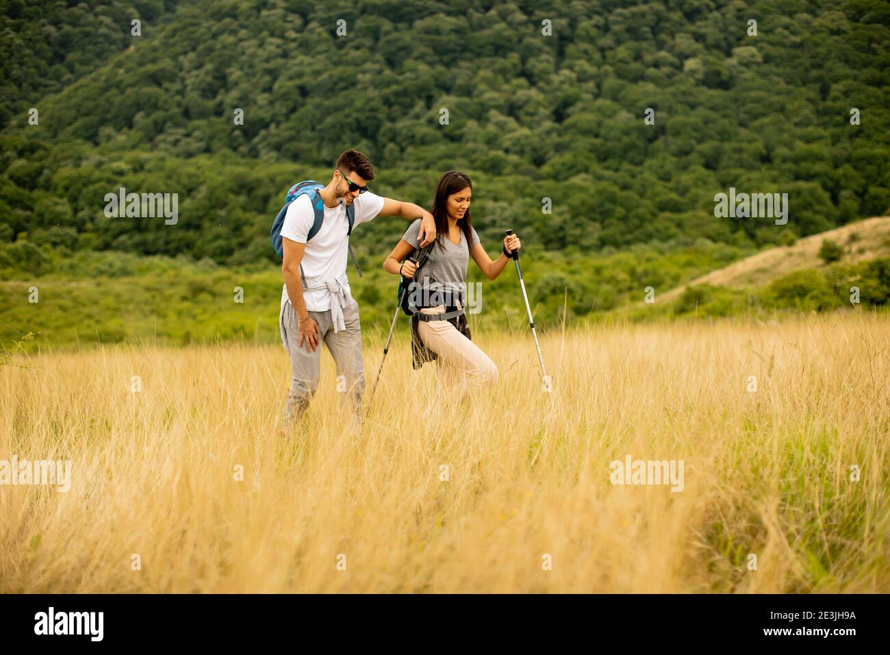 Young man walking over field hi-res stock photography and images - Alamy