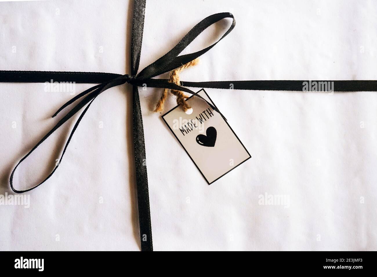 gift box with tag on wooden background Stock Photo