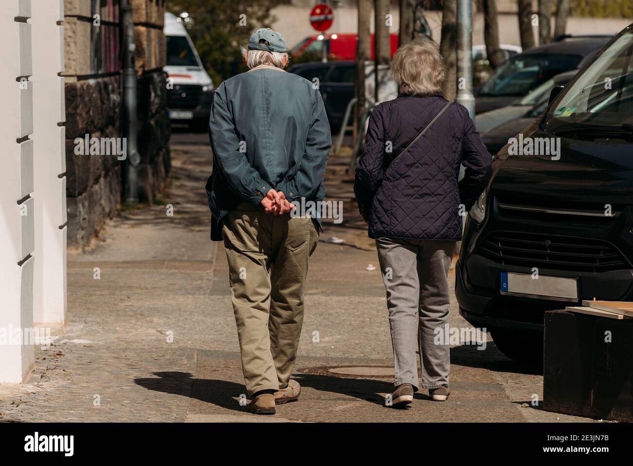 Old Couple from behind, An old couple is walking in the spring ...