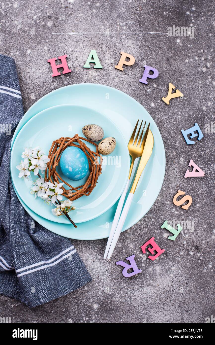 Easter table setting with blue egg Stock Photo