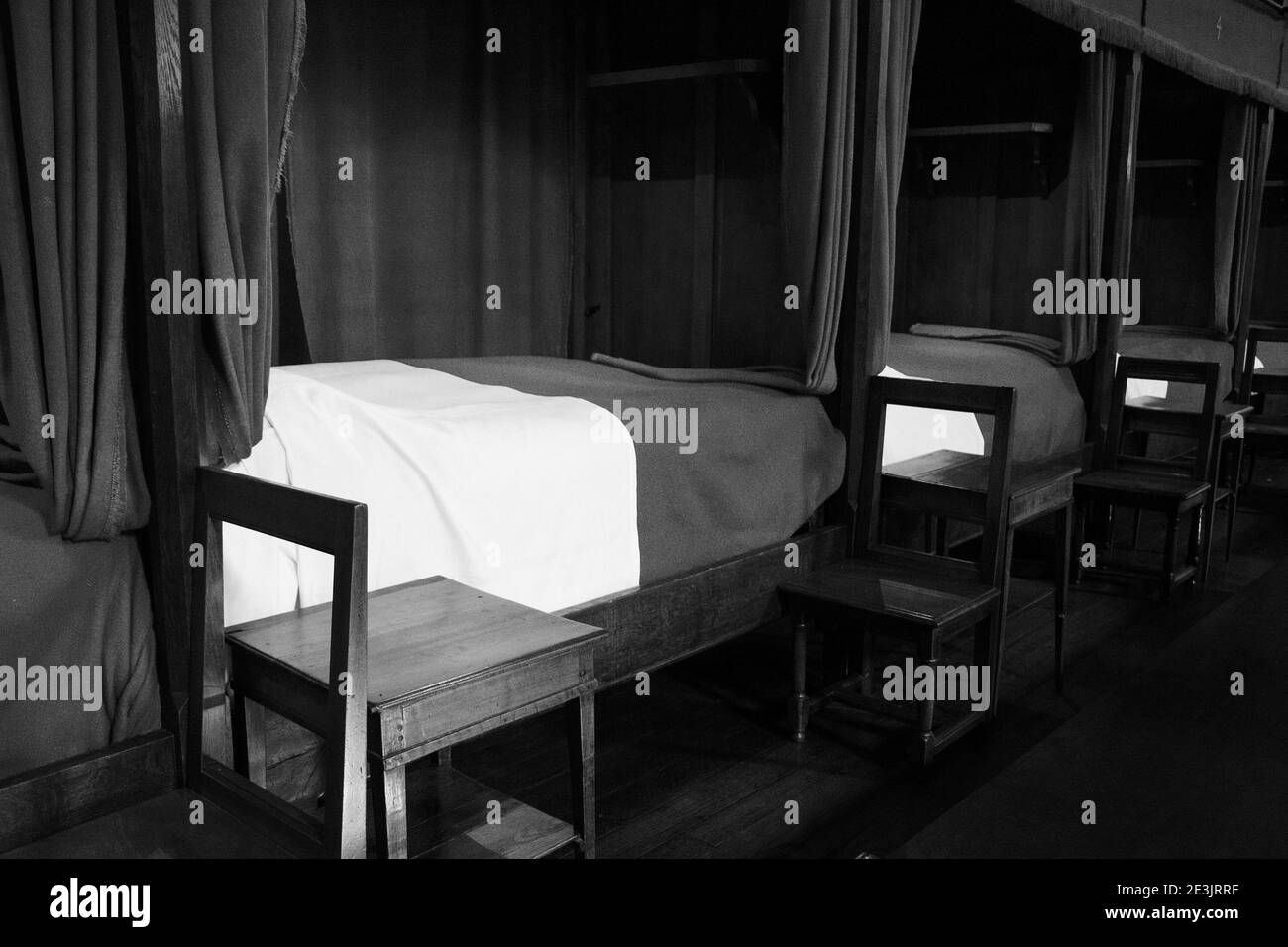 BEAUNE, FRANCE - AUGUST 17, 2018: Hospices or Hotel-Dieu de Beaune, hospital for poor people founded in 1443. Interior. Patient beds. Black white Stock Photo