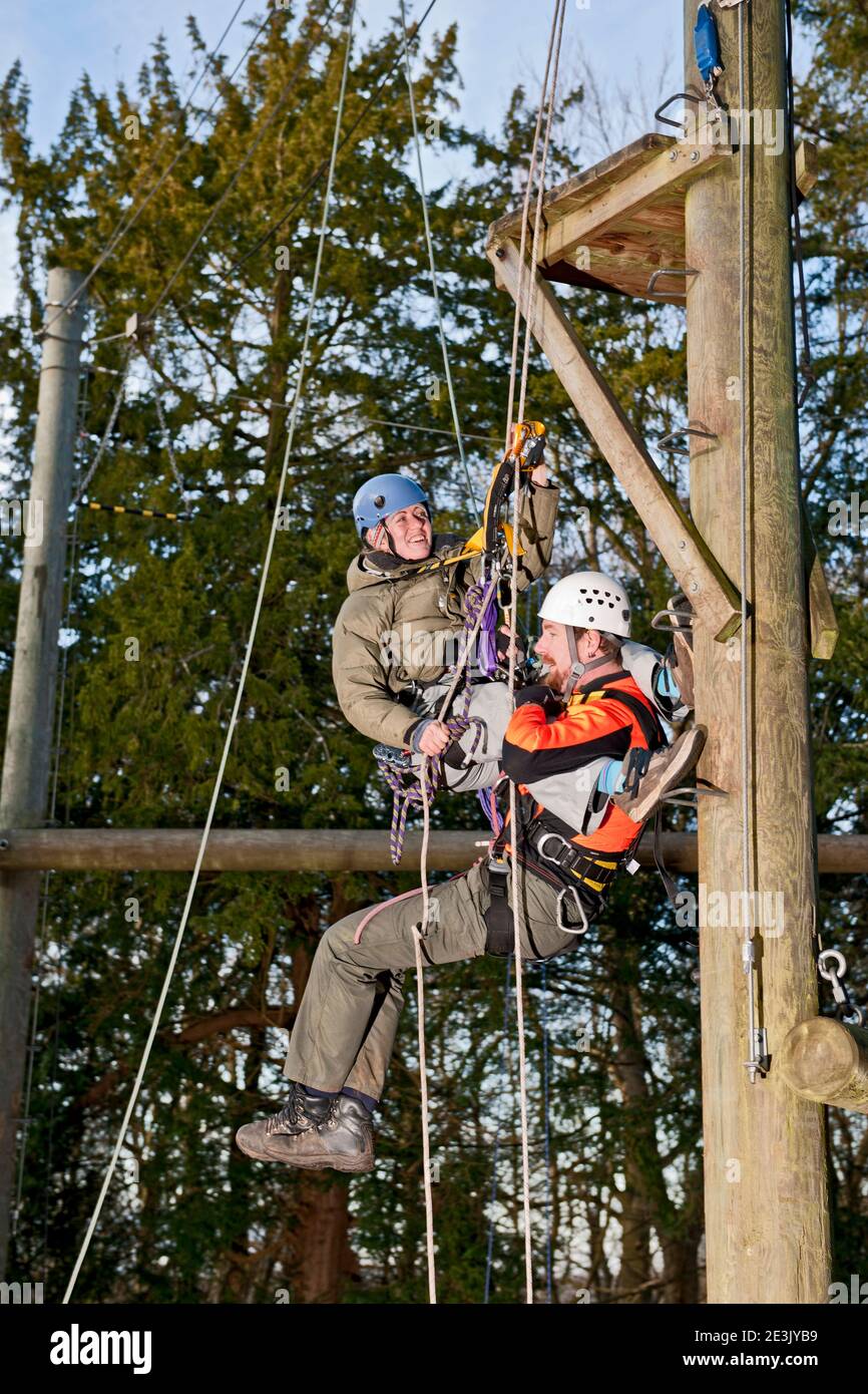 Companion Rescue Off Rope couple practising rescue scenario at high rope training exercise Stock ...