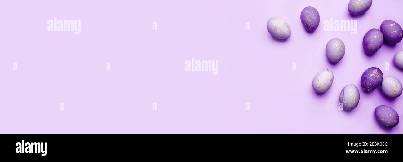 Easter frame of eggs painted in purple color Stock Photo - Alamy