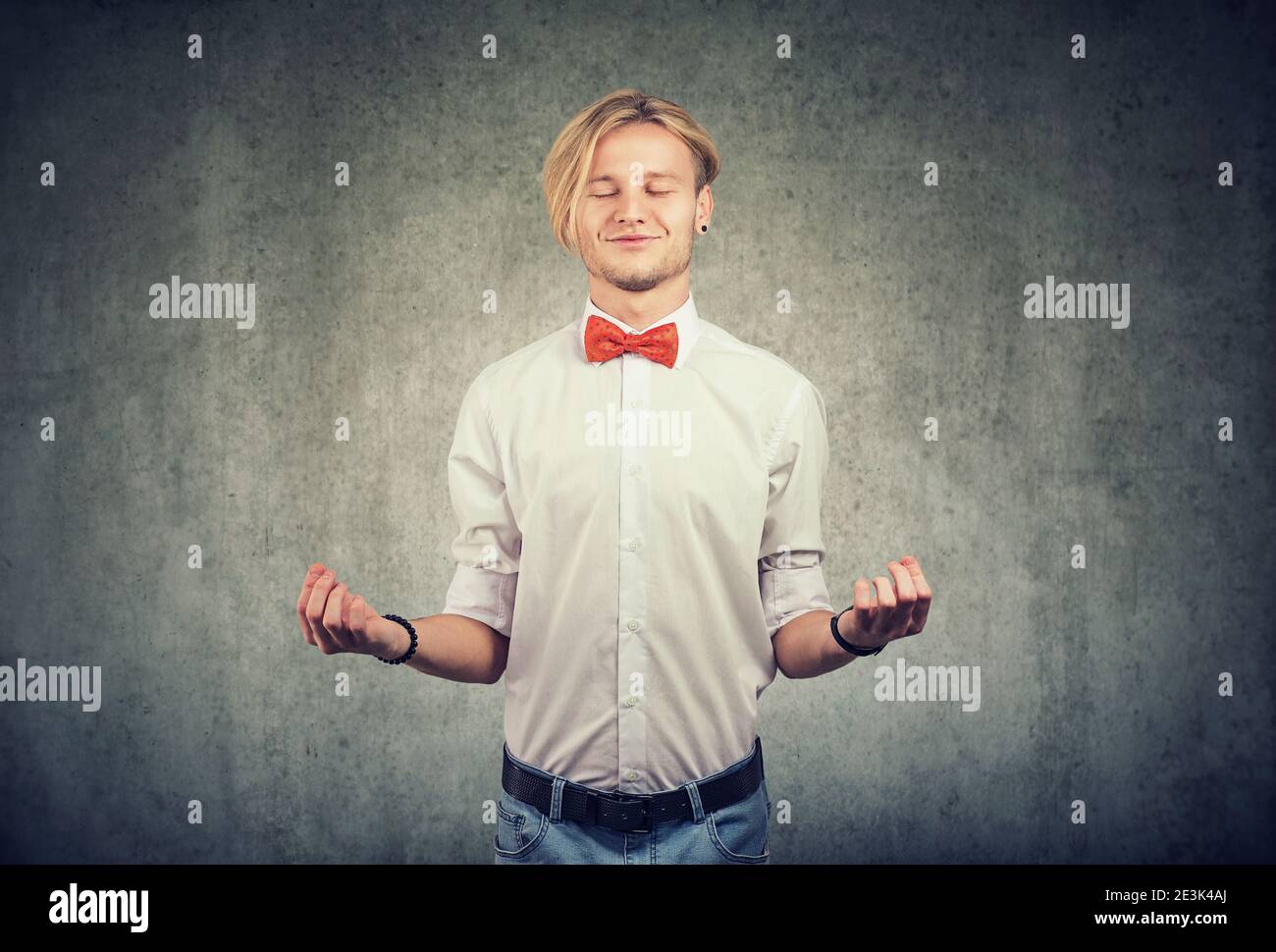 Portrait of a young happy man meditating Stock Photo