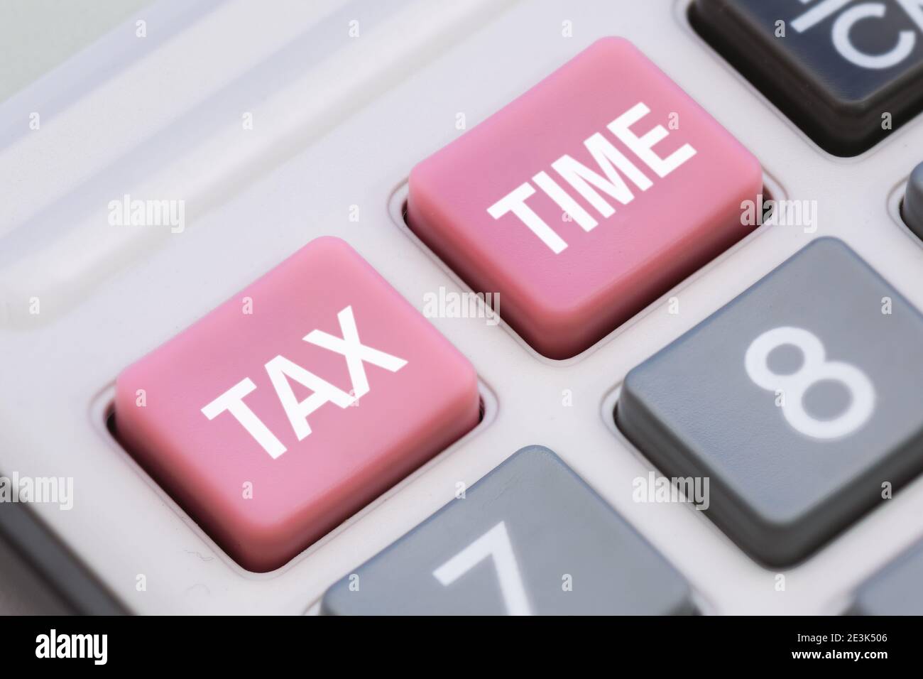 Close Up of Tax Time Words on Calculator Buttons Stock Photo