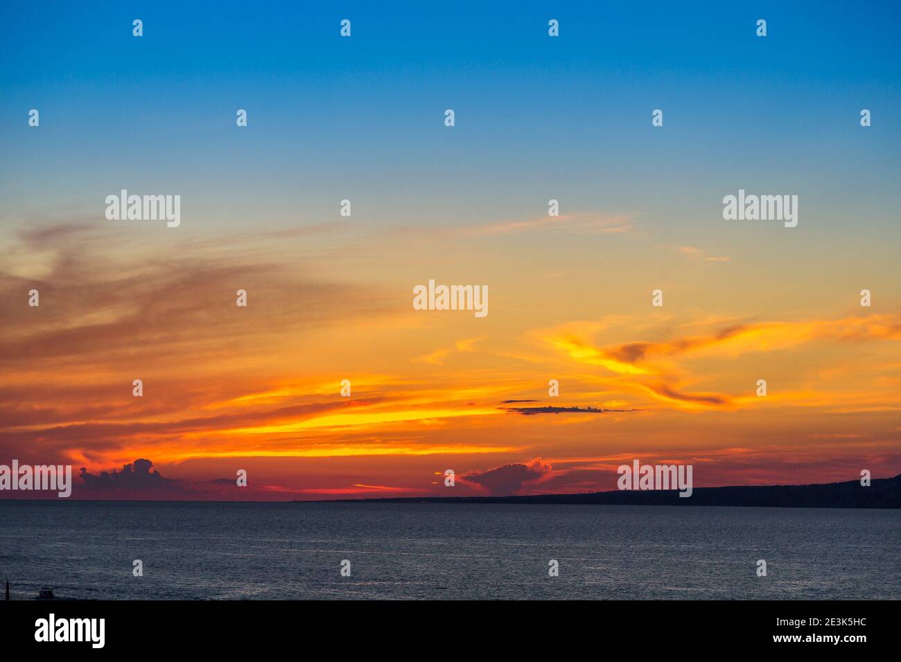 View of a beautiful sunset above the sea Stock Photo - Alamy