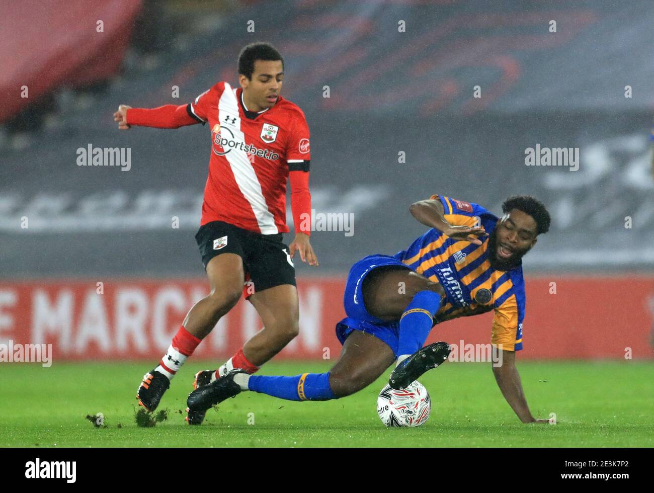 Southampton's Caleb Watts (left) and Shrewsbury Town's Ro-Shaun Williams (right) battle for the ball during the Emirates FA Cup third round match at St Marys Stadium, Southampton. Picture date: Tuesday January 19, 2021. Stock Photo