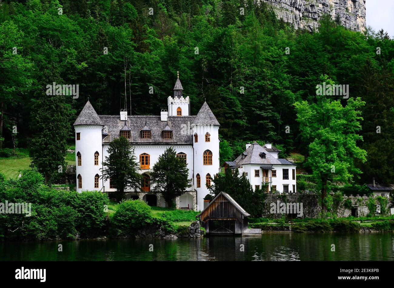 big beautiful white castle at the lake in the mountains Stock Photo