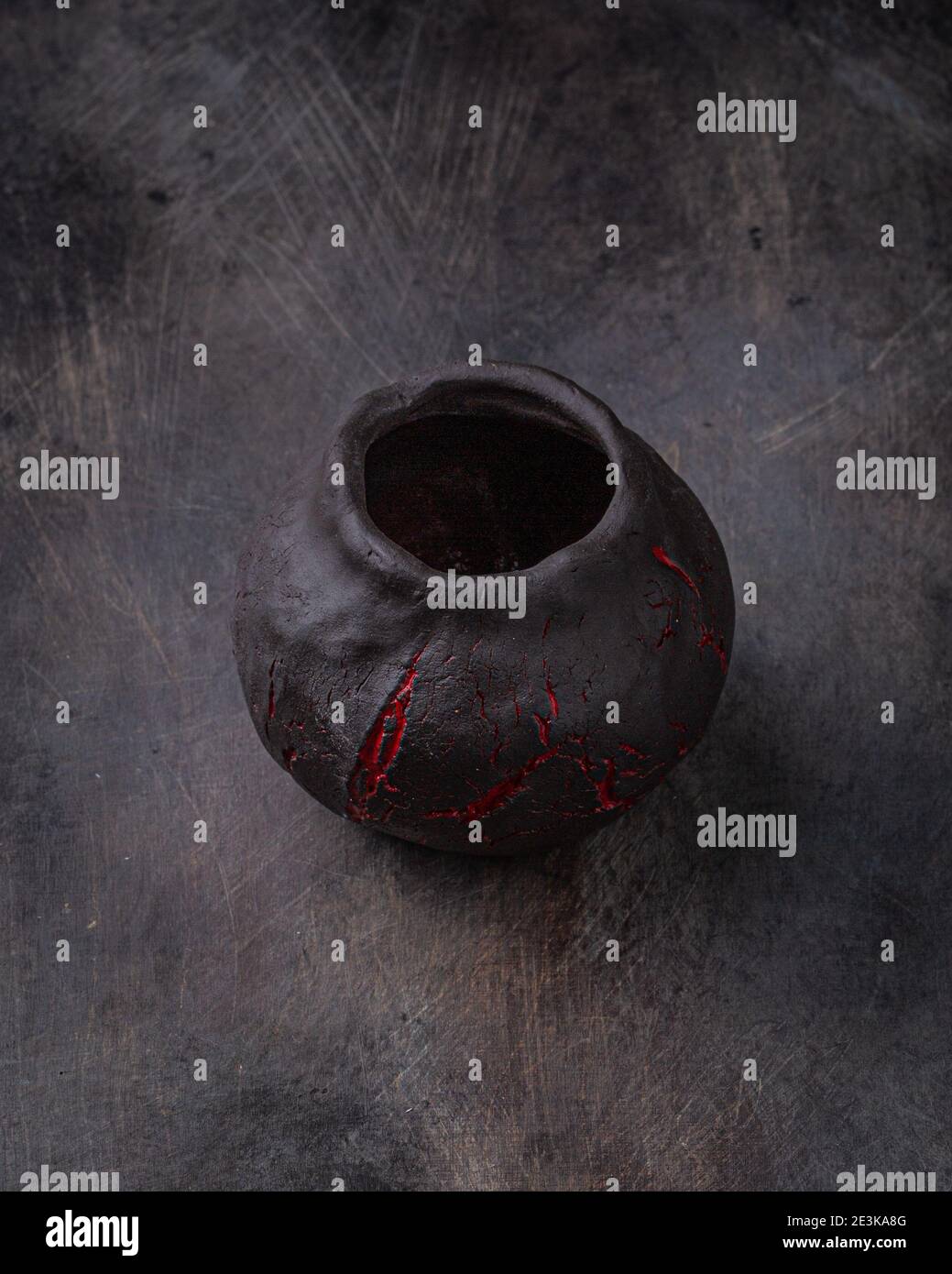 Handmade ceramic cup on dark stone backgroud, copy space. Stock Photo