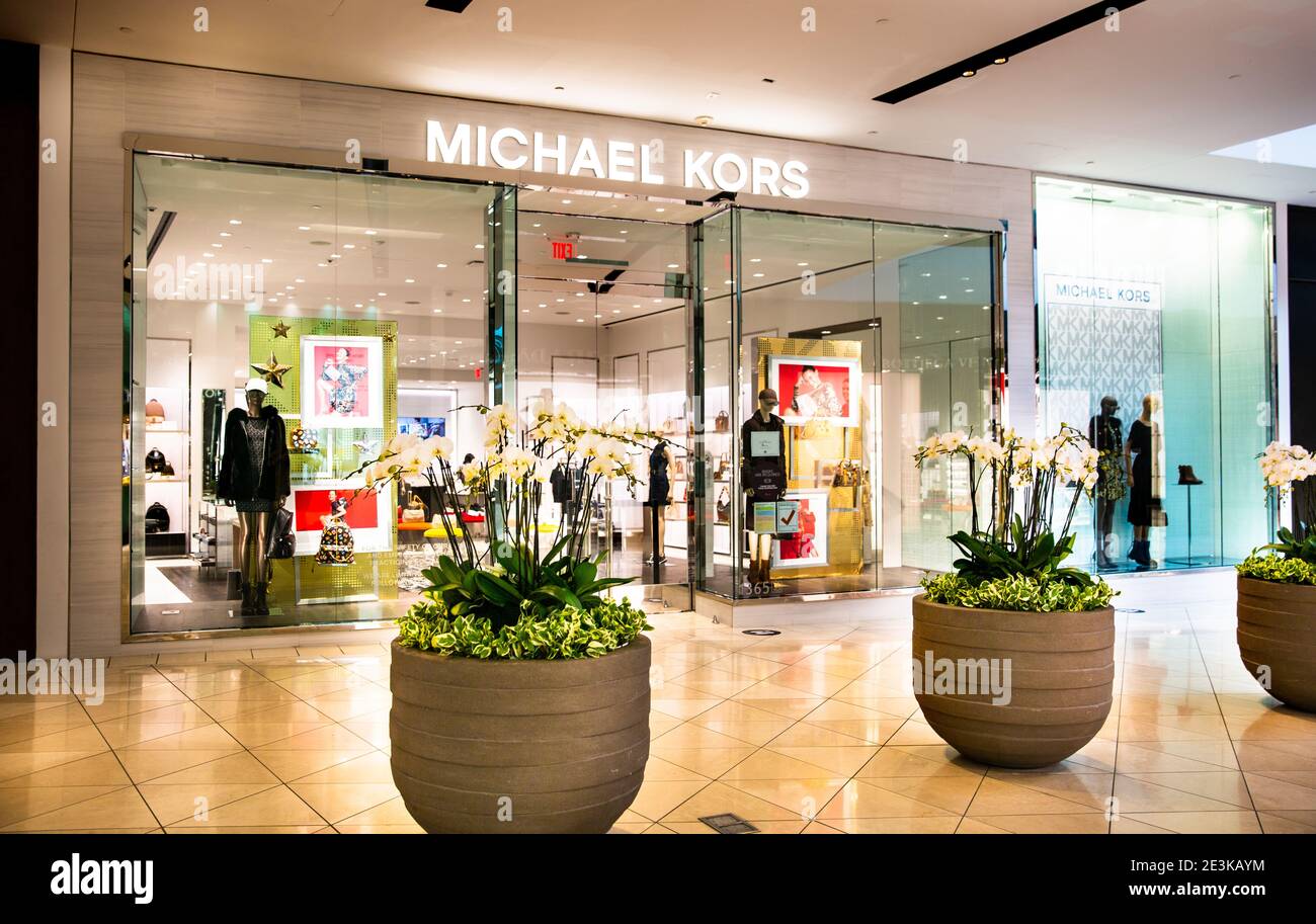 Handbags on display at the Michael Kors boutique within Macy's in New York  on Tuesday, August 4, 2015. First-quarter sales and profits for Michael  Kors handbag designer beat analysts' expectations, albeit low