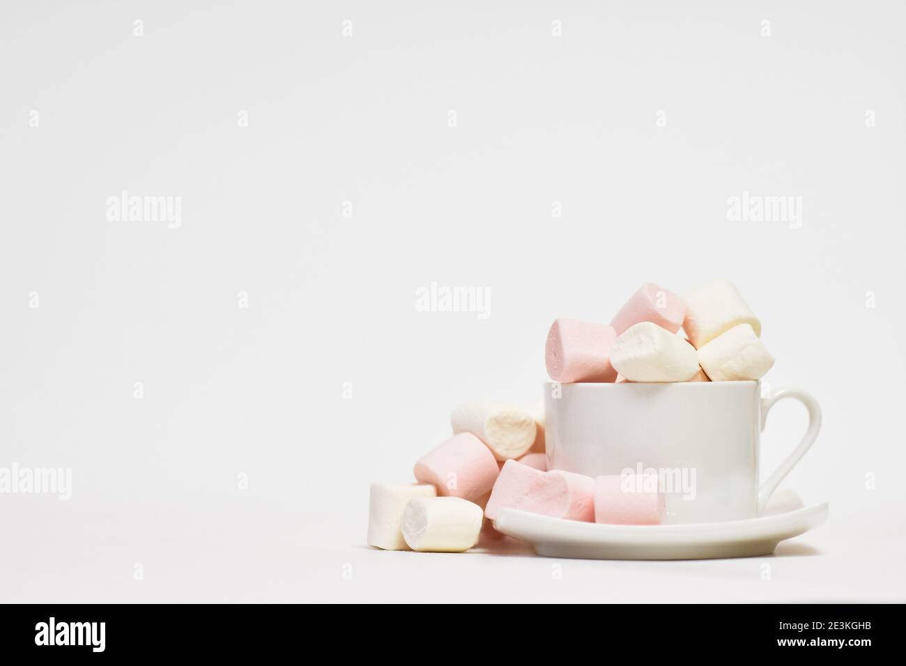 Close Up Of Coffee Cup With Marshmallows on a white background Stock Photo