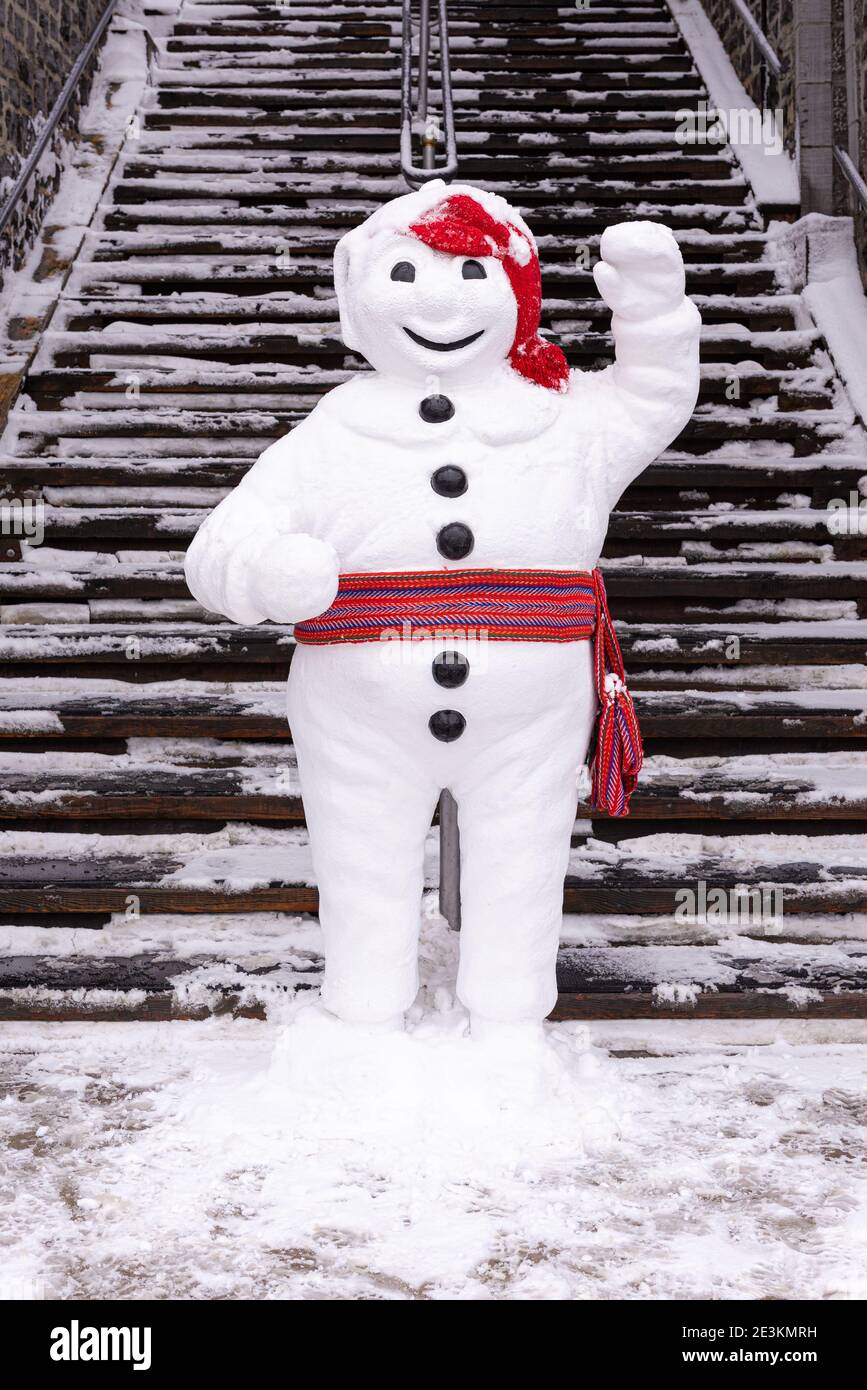 The Quebec carnival mascot « Bonhomme » in the Petit Champlain. Stock Photo
