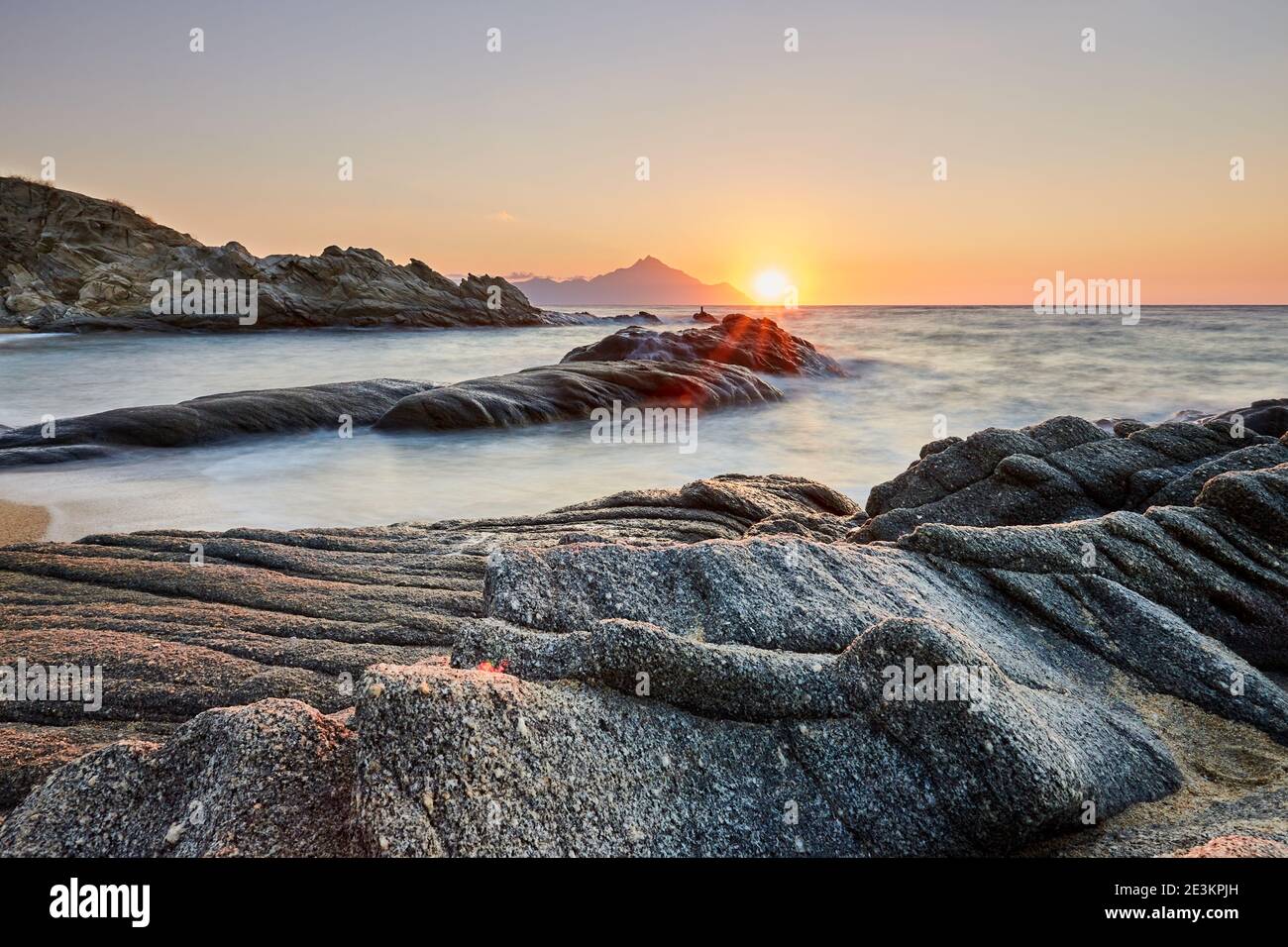 Scenic sunrise at Sarti beach, Chalkidiki, Greece; golden sunrise over