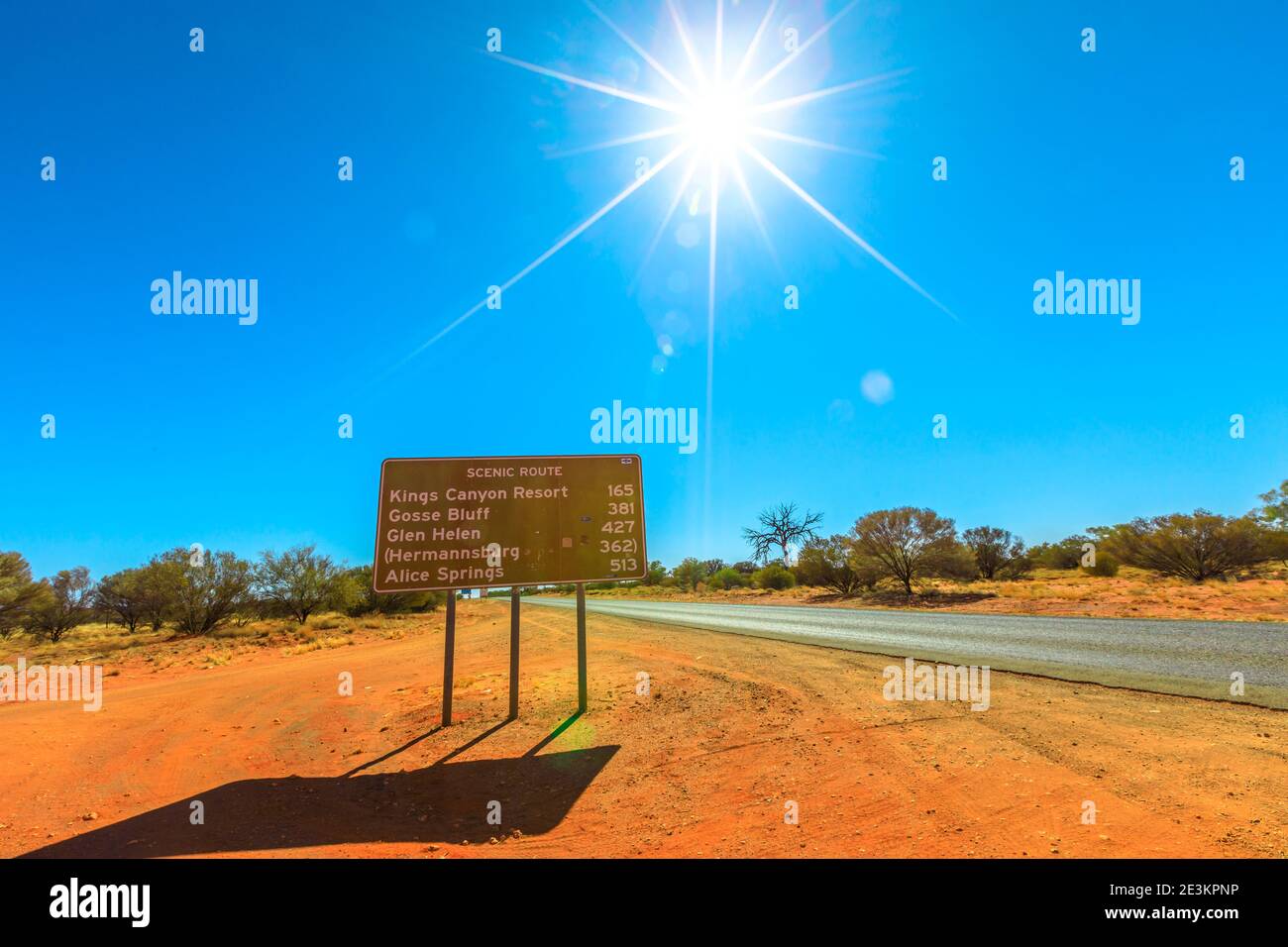 Road sign of scenic route to Watarrka National Park and Alice Springs, Outback Red Center. Kings Canyon in Northern Territory, Australia. Sunny day Stock Photo