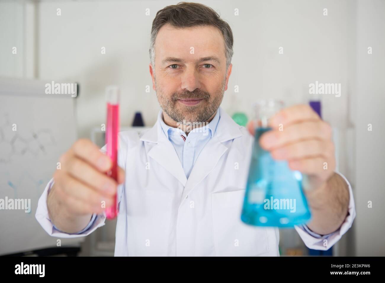 Male scientist holding test hi-res stock photography and images - Alamy