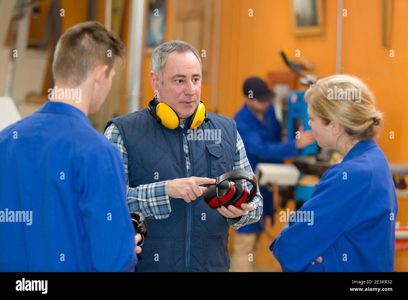 young students apprentice in workshop Stock Photo