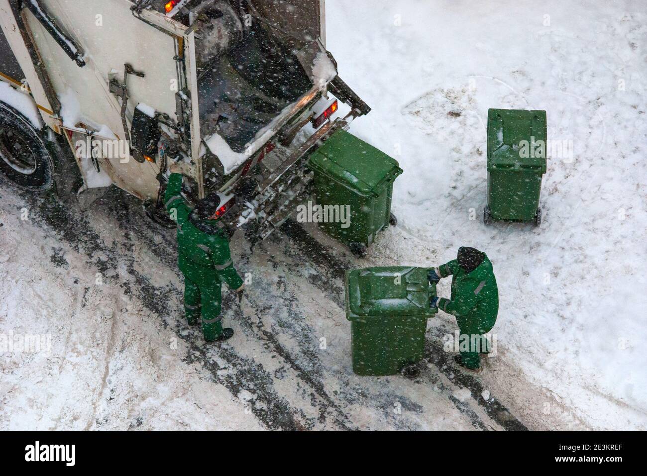 household waste collection in winter snowy weather Stock Photo