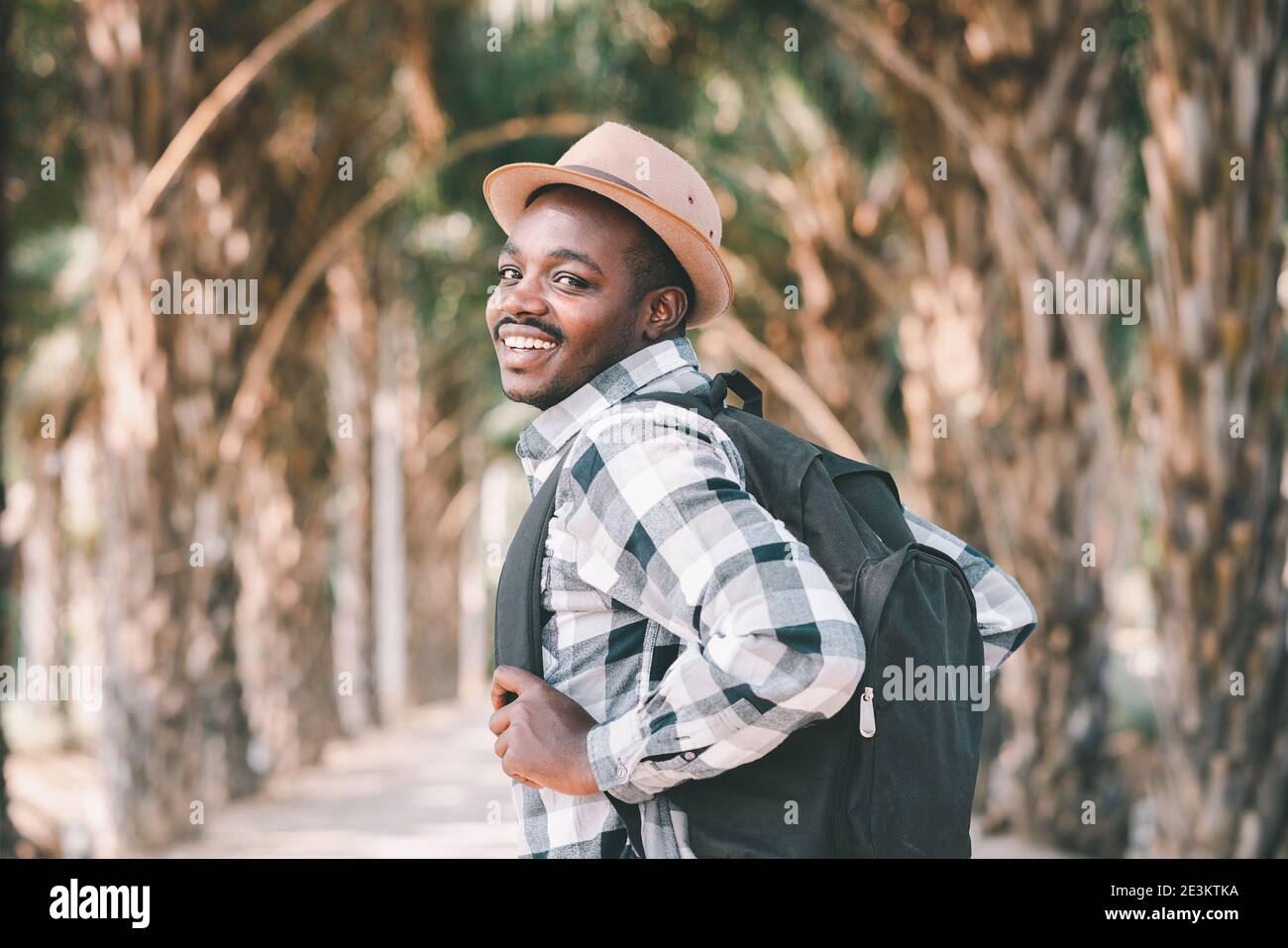 Man carrying backpack walking hi-res stock photography and images - Alamy