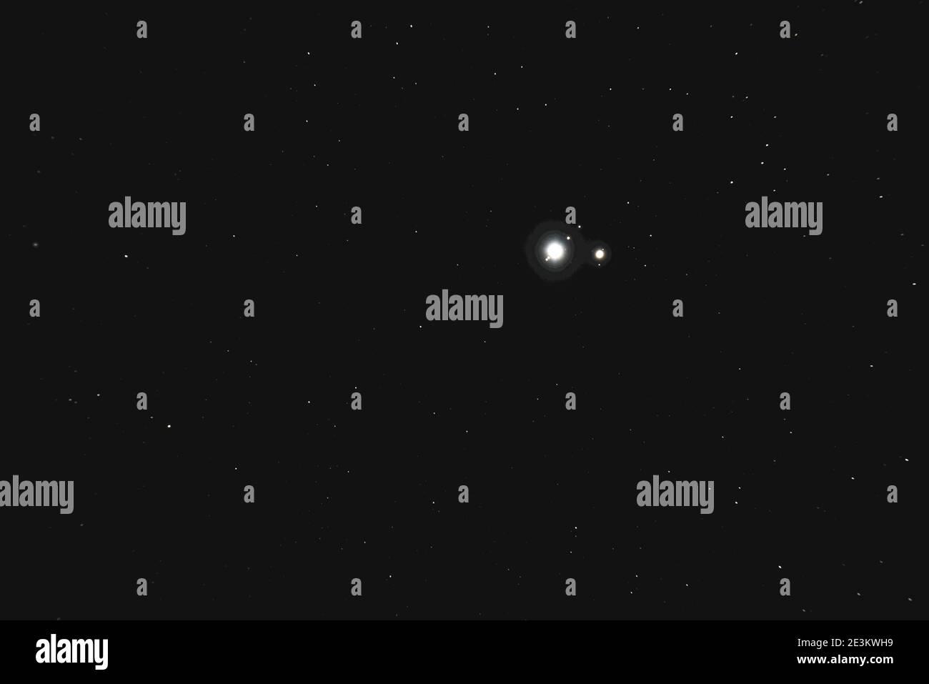 The Great Conjunction an amazing and historical astronomical event. A time lapse view from an amateur telescope of Jupiter and Saturn planets Stock Photo