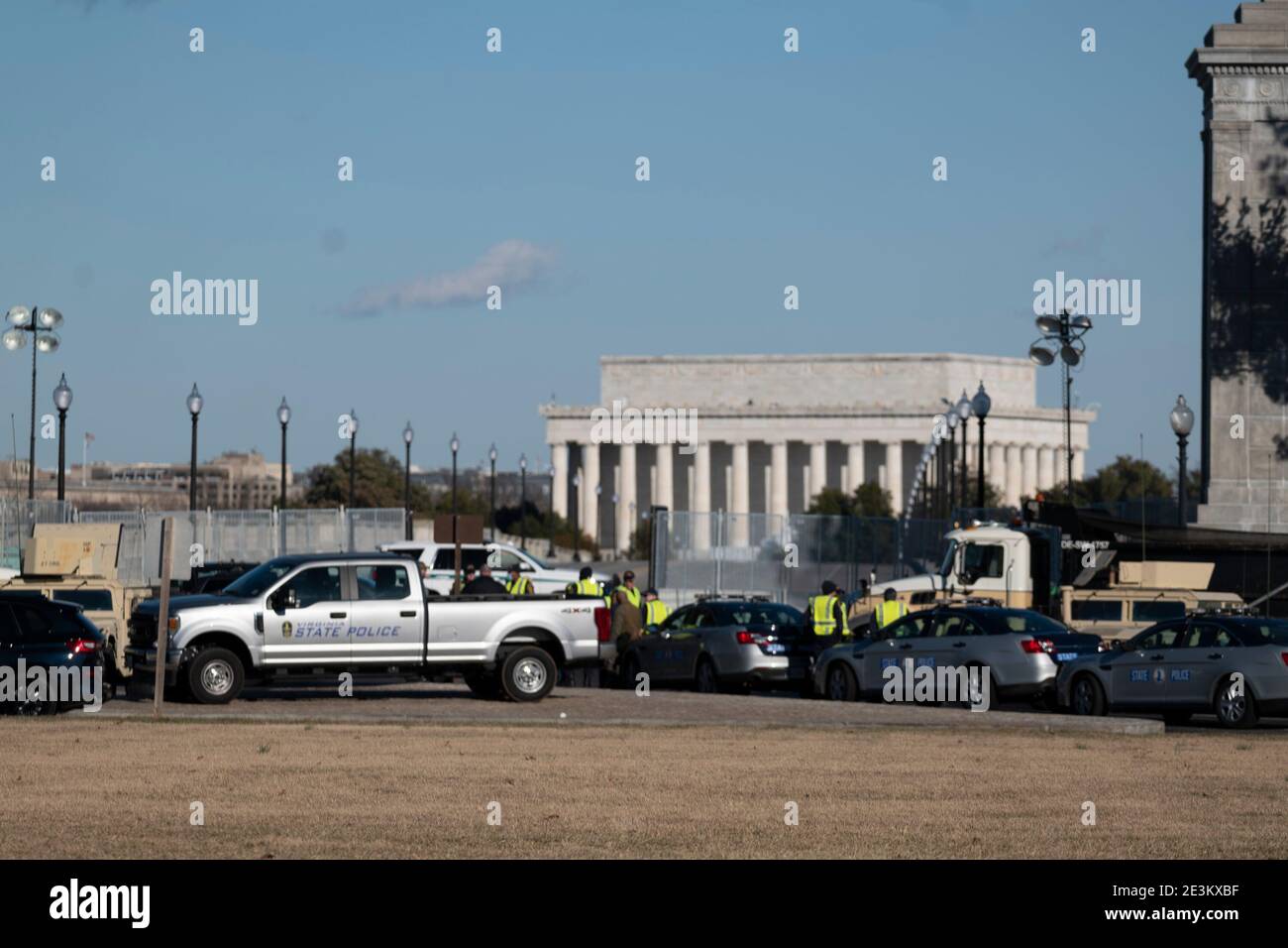 January 19, 2021: Virginia State Police as well as the A U.S. National Guard blocking off vehicle traffic to the memorial bridge leading to Washington, DD. stands on the ready behind a security fence on the grounds of the Lincoln Memorial in Washington, DC. Later both President-elect Biden and Vice President-elect Harris attended a somber ceremony honoring COVID-19 victims at the Lincoln Memorial Credit: Brian Branch Price/ZUMA Wire/Alamy Live News Stock Photo