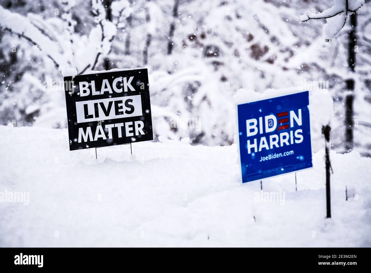 Dramatic image of Black Lives Matter, Biden Harris signs in the snow. Stock Photo