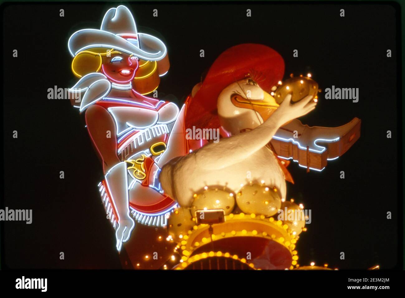 Iconic neon cowgirl sign and sign  for the Golden Goose casino at Glitter Gulch on Fremont Street in Las Vegas, Nevada Stock Photo
