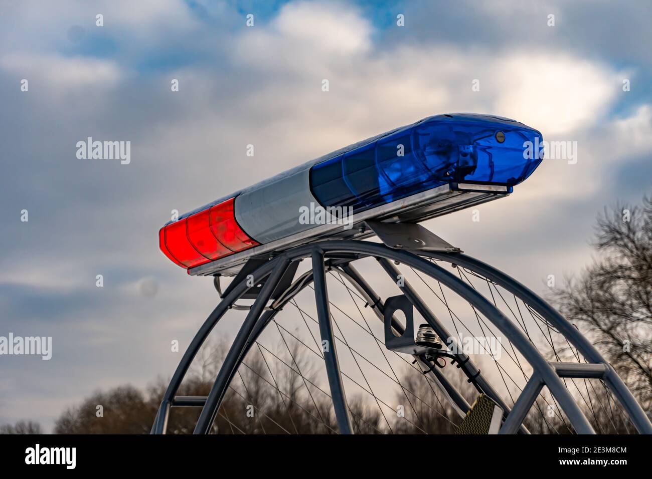Police flashers on a snowmobile close up, police all-terrain vehicle in winter, air-cushion boat Stock Photo