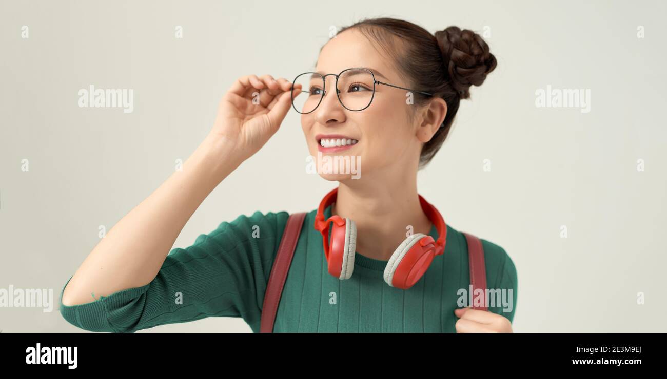 gorgeous lady touching glasses isolated over white background Stock Photo
