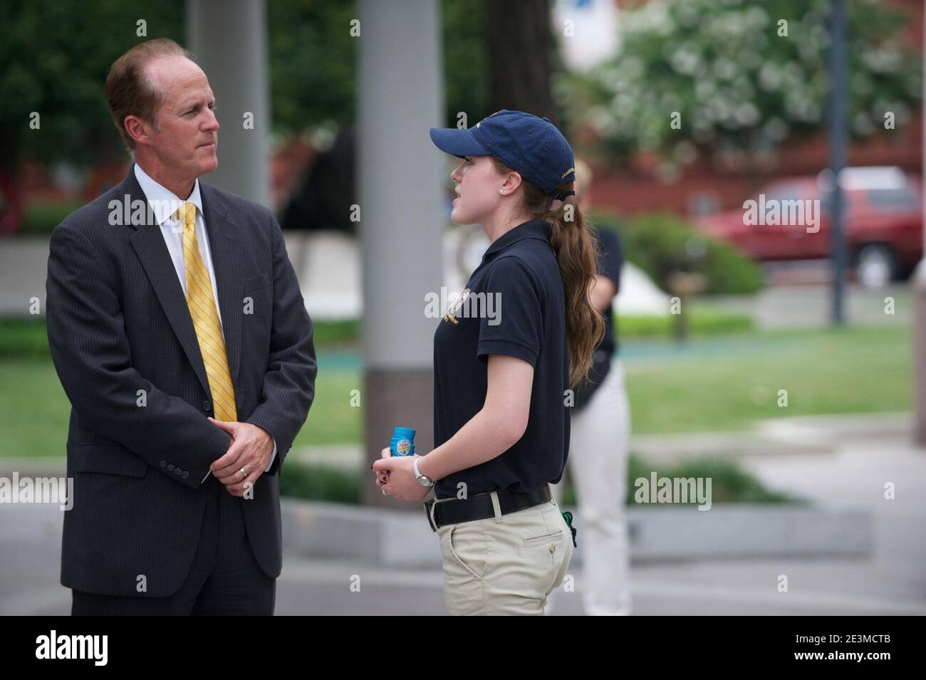 Man converses with law enforcement explorer. Stock Photo