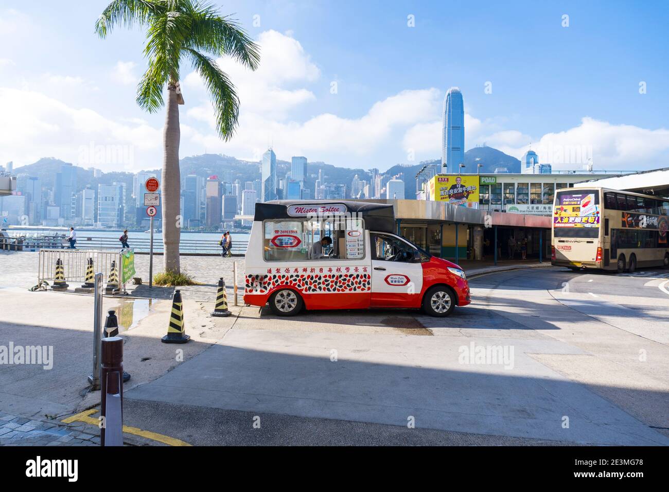Mister Softee Ice Cream Truck parked next to Coconut Tree, Kowloon. Medium Shot, Eye Level View Stock Photo