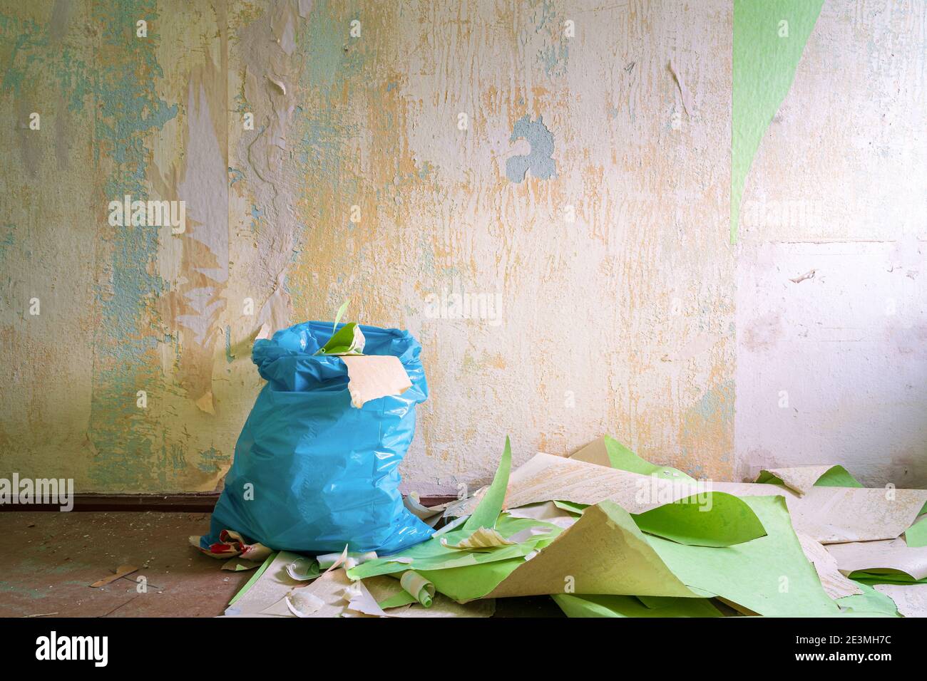 Peeling off wallpaper during interior home repair renovation and