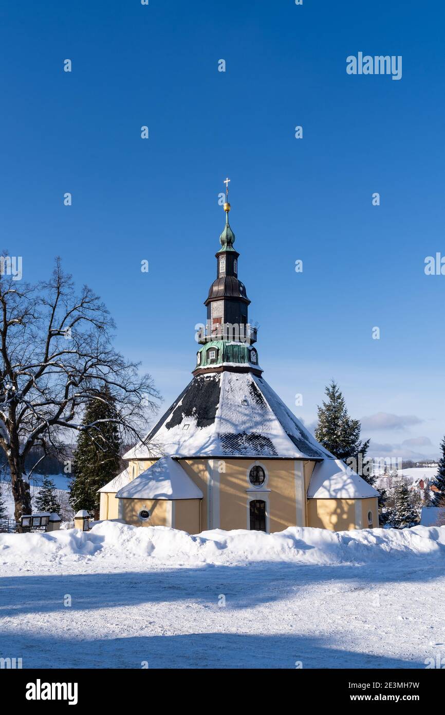 Church in Christmas Village Seiffen Ore Mountains in Saxony Germany at wintertime. Stock Photo