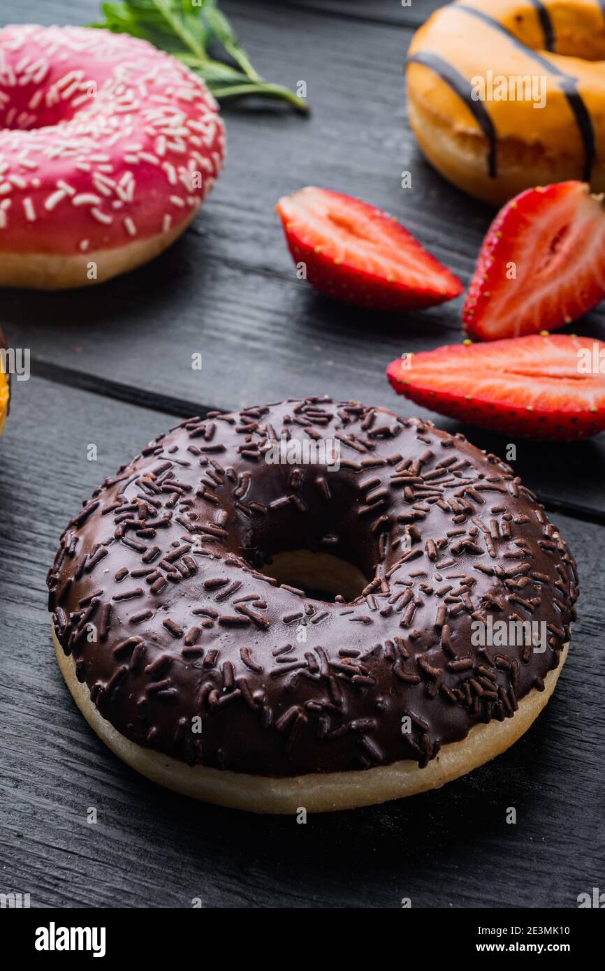 Chocolate donuts set, on black wooden table background Stock Photo - Alamy
