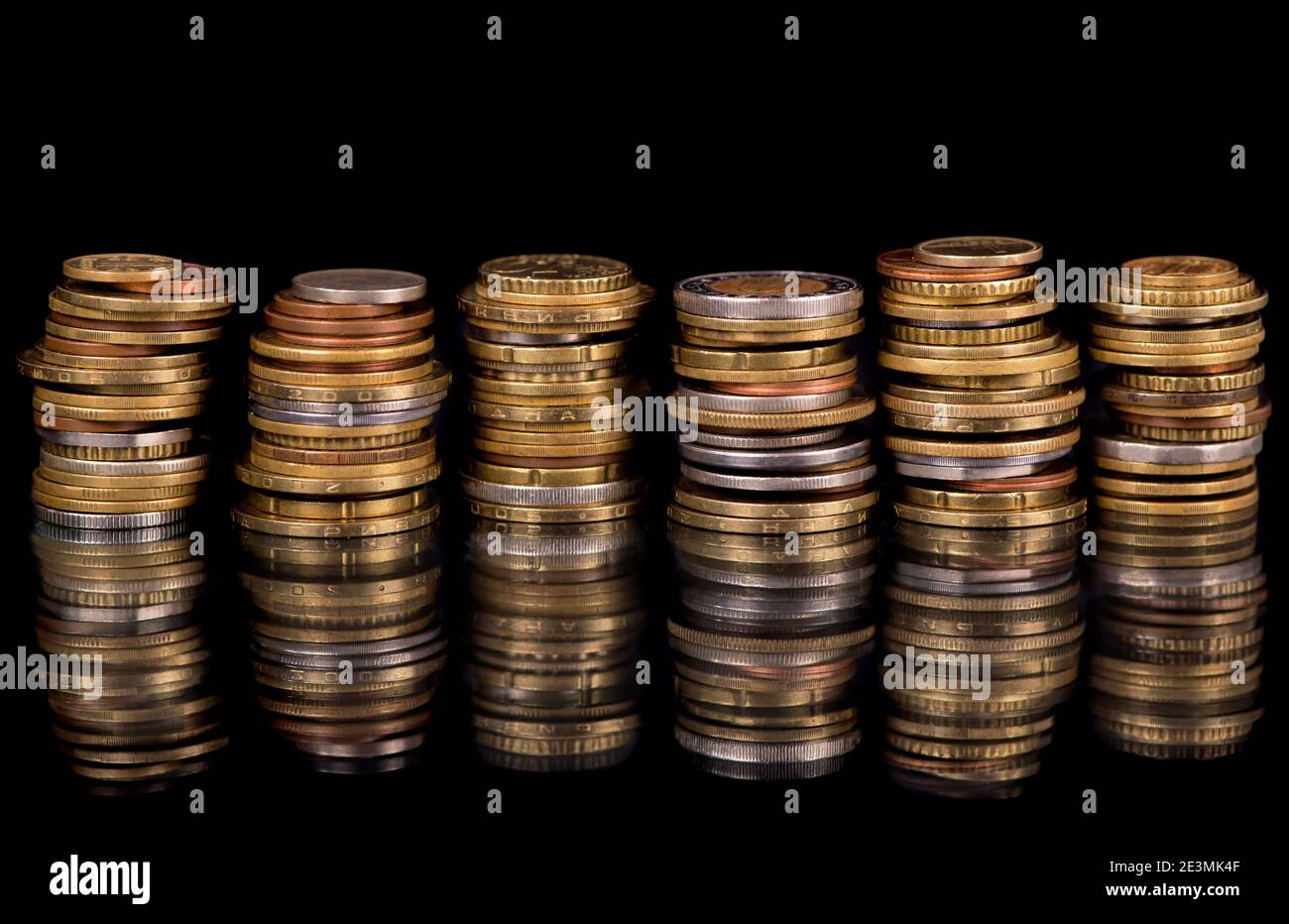 Composition of the coins on the black background Stock Photo - Alamy