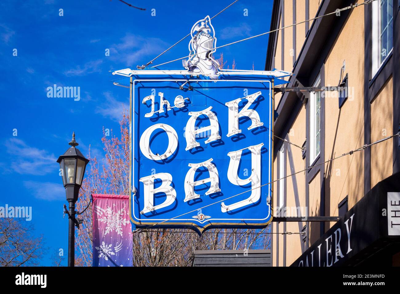A view of the Oak Bay Theatre neon sign, in the historic Castle Block on Oak Bay Avenue in Oak Bay Village, Victoria, Canada. Stock Photo