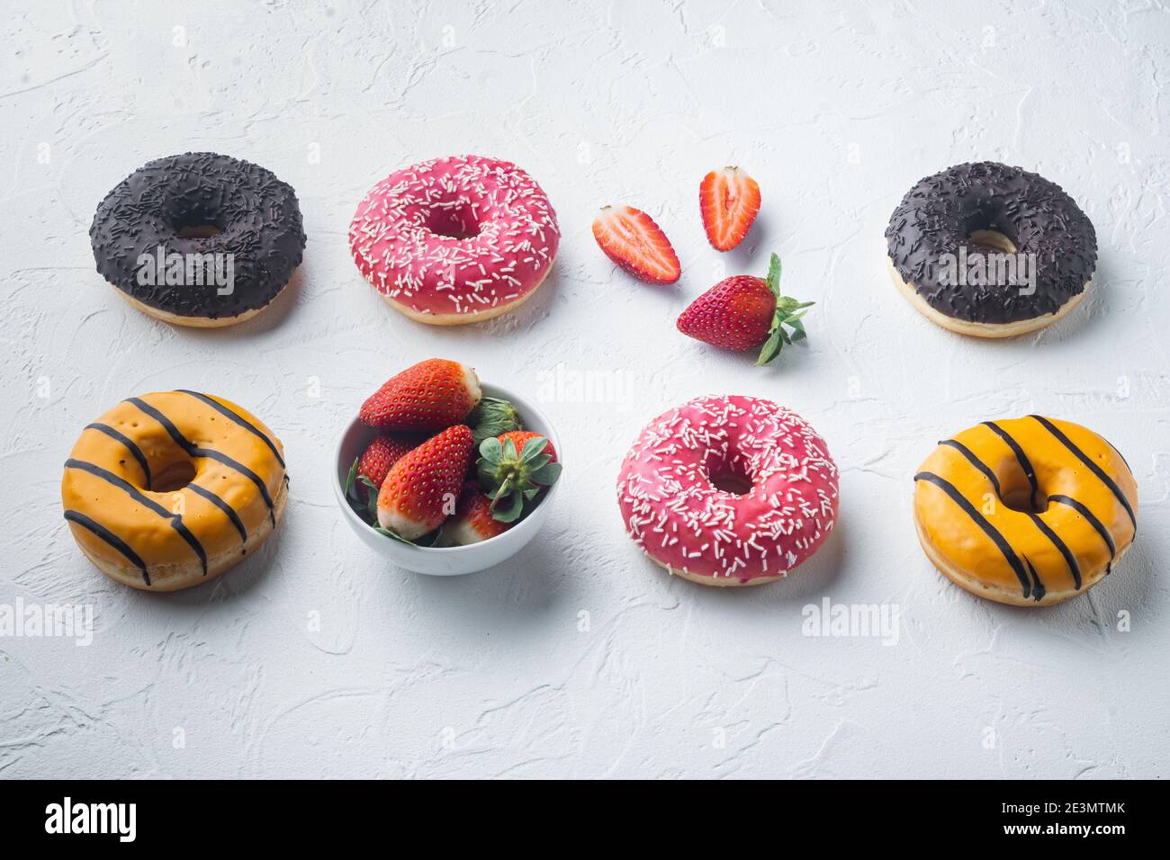 Delicious glazed donuts set, on white background Stock Photo - Alamy