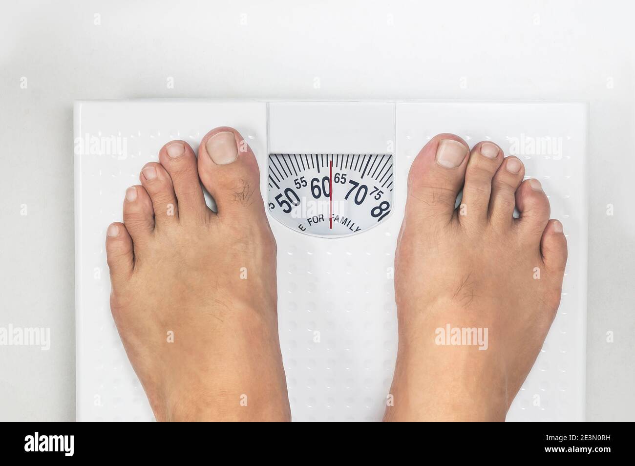 Human Foot On Weighing Scale Stock Photo - Alamy