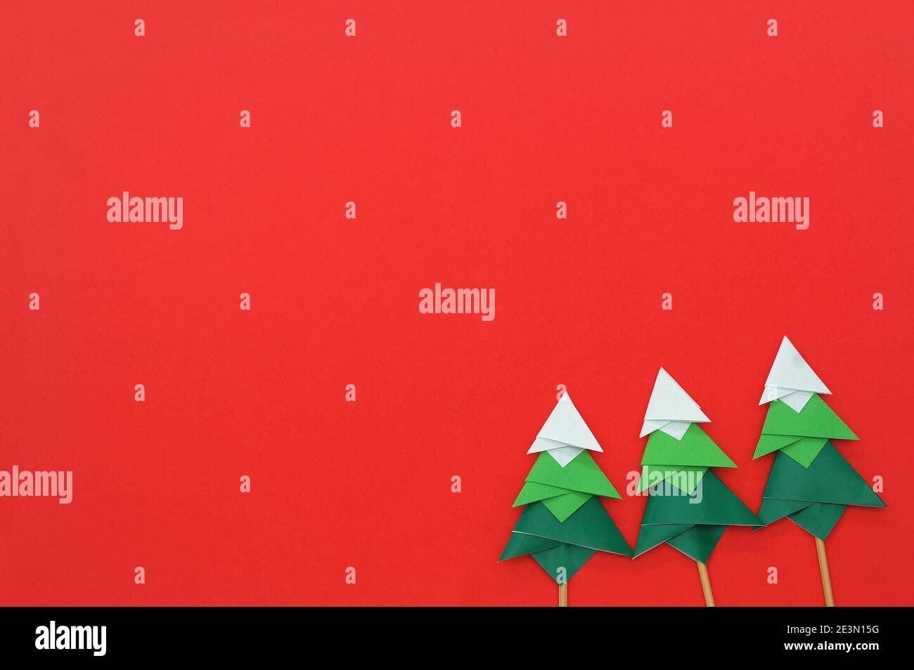 Handmade origami paper craft Christmas tree on red paper Stock Photo ...