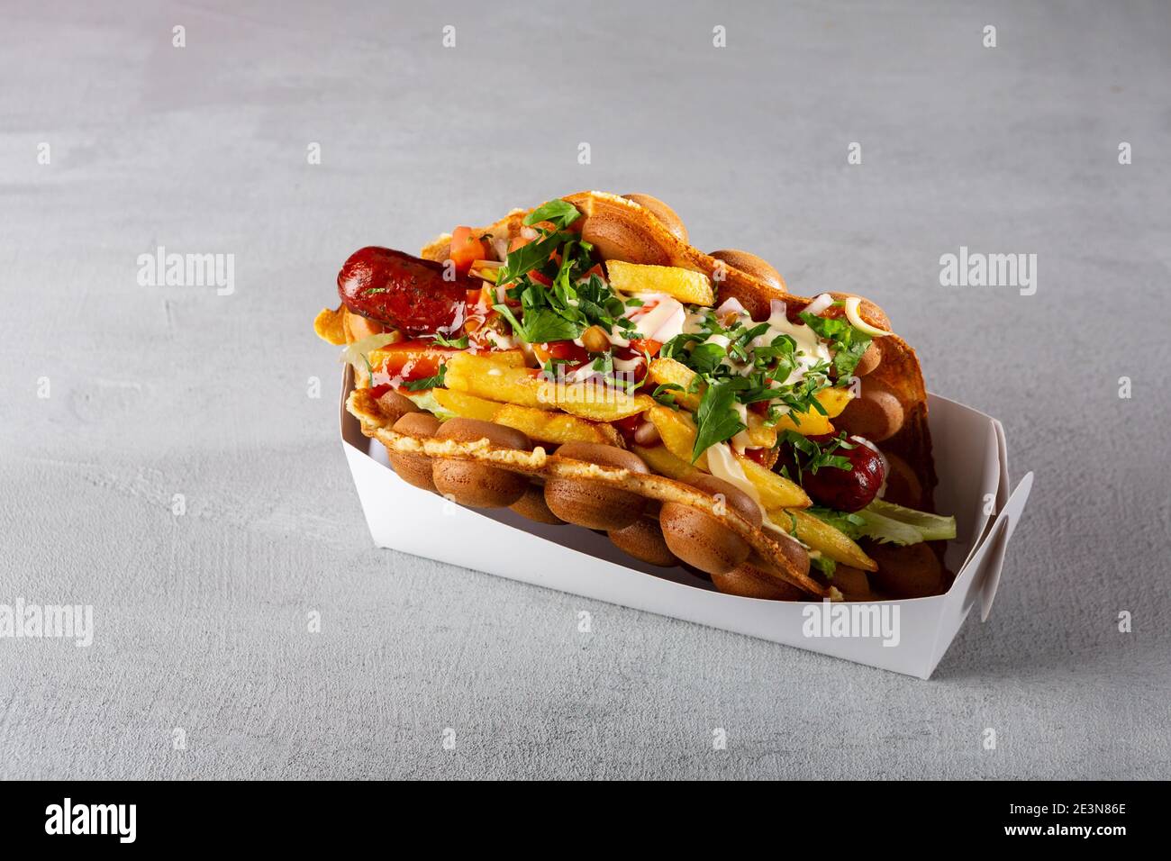 Savory Hong kong or bubble waffle, hot dog Stock Photo Alamy