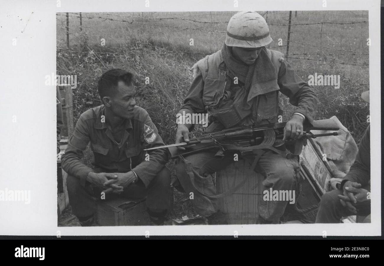 Marine from Company M, 3.5 Marines examines a captured AK-47 Stock ...