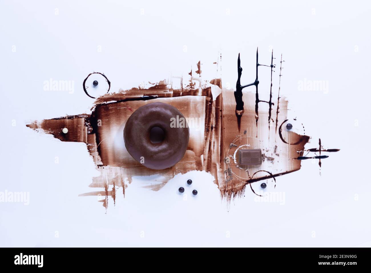 Chocolate donuts and chocoolate on white background. Top view. Stock Photo